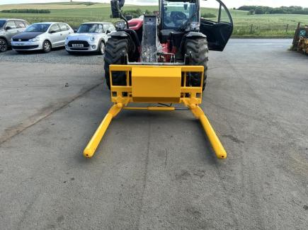 Wrapped bale handler with Kramer 580T hooks